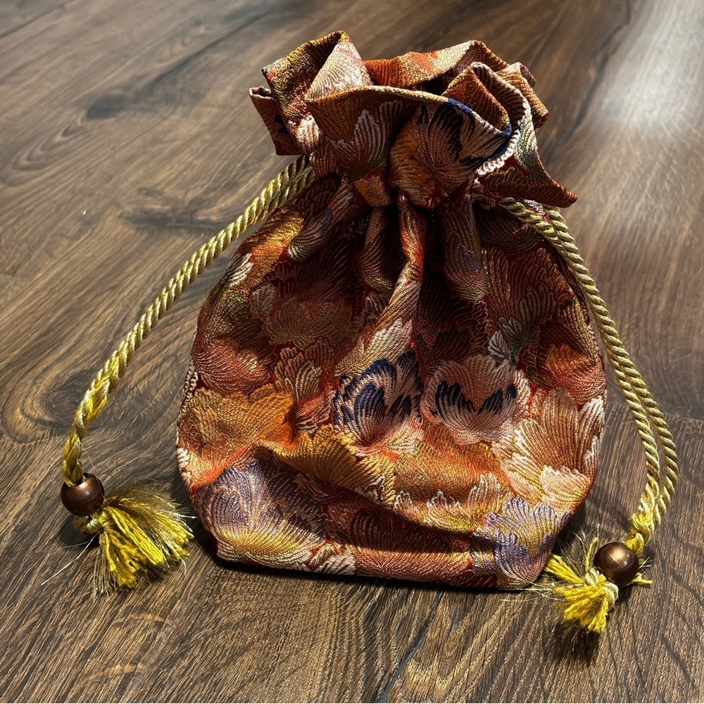 Super cute satin/silk Asian inspired tassel beaded cinch up bag